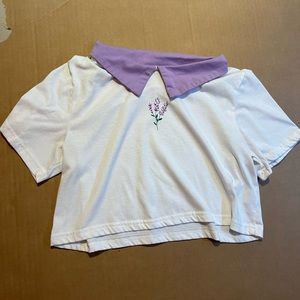 white t-shirt with purple collar and a lavender plant on the front